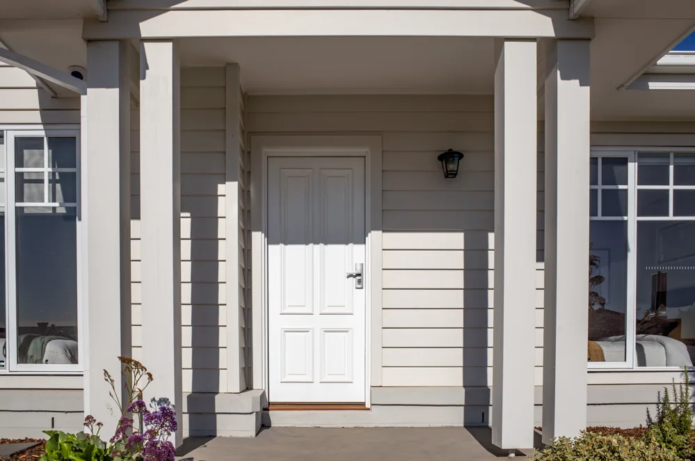 Pale weatherboard facade and white entrance — exterior colour inspiration