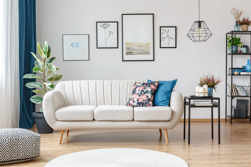 Bright white living room with blue accents — residential finish inspiration